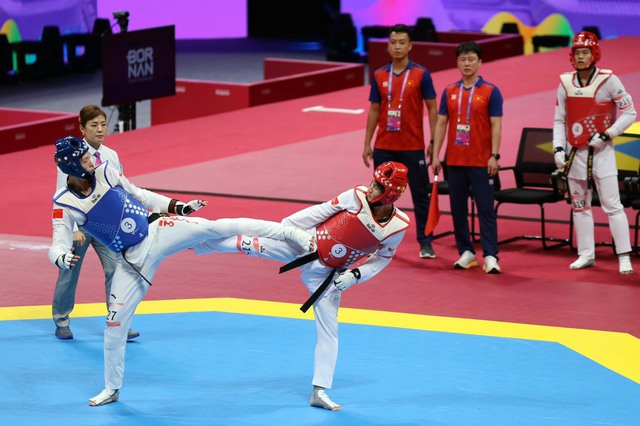 Taekwondo giành tấm HCĐ thứ 5 cho đoàn Thể thao Việt Nam tại ASIAD 19 - Ảnh 1. Taekwondo giành tấm HCĐ thứ 5 cho đoàn Thể thao Việt Nam tại ASIAD 19 - Ảnh 1.